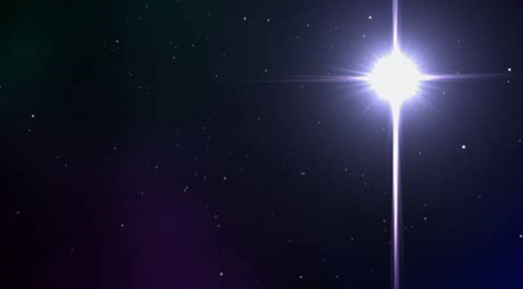 Bright star shining in a dark night sky with scattered smaller stars.